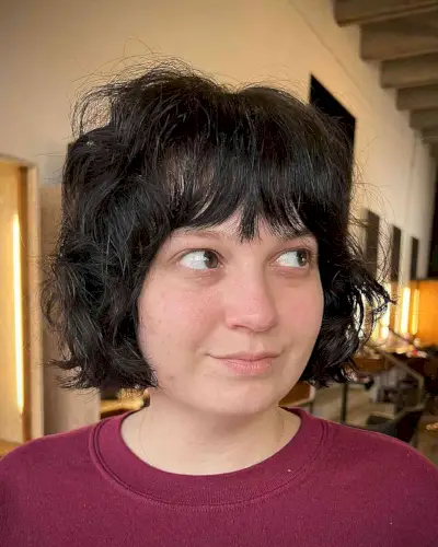 Chin-Grazing Shaggy Bob with a Fringe for Round Faces