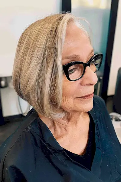 Blonde-highlighted A-Line Bob creating a youthful silhouette for women over 70.