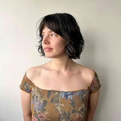 French Bobbed Haircut with Middle-Parted Bangs