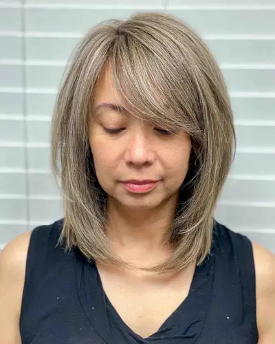 lob with side bangs for ladies with round faces