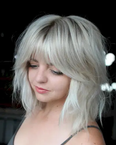 Tousled Lob with Curtain Bangs for a Lady with a Round Face