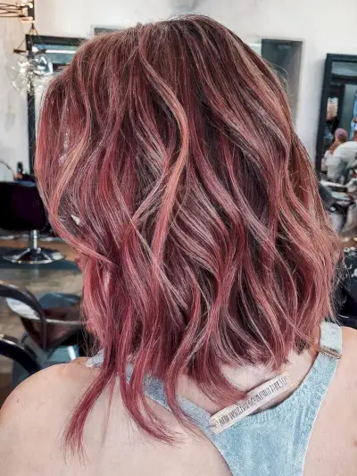 Messy Piece-y Wavy Bob with Magenta Highlights