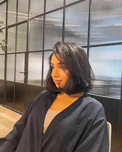 Neck-Grazing Bouncy Layered Italian Bob Haircut