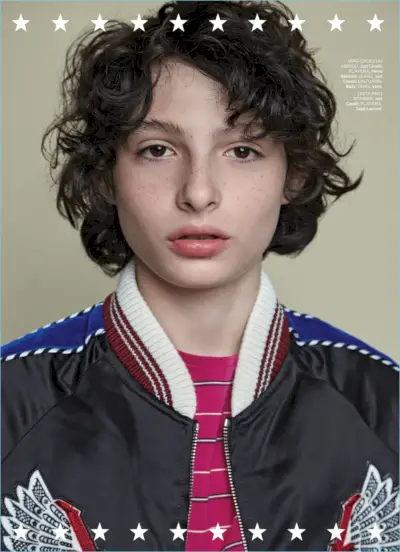 Finn Wolfhard draagt ​​een Just Cavalli-bommenwerper en draagt ​​ook een gestreept Saint Laurent-T-shirt.