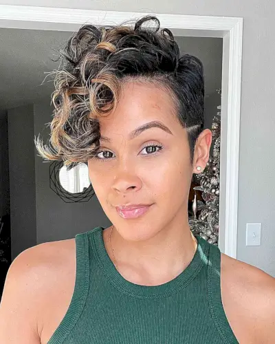 Curly Pixie Cut with a Side Part and Highlights for black ladies with relaxed hair