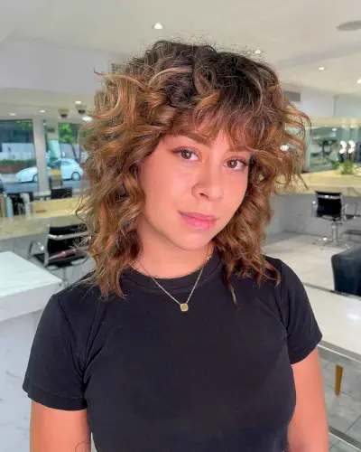 Curly Wolf Haircut with Bangs for Women Over 40