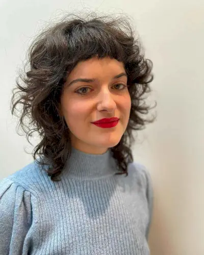 Mid-Length Curly Shag with a Mini Fringe