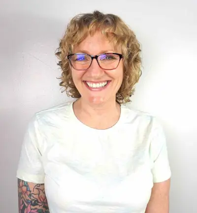 Short Shaggy Blonde Curls with Micro Bangs