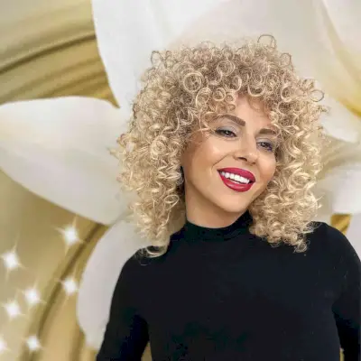 Medium natural curly blonde hairstyle