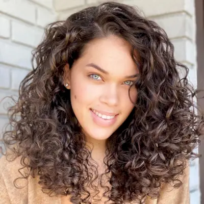 Dark brown medium length curly hair style