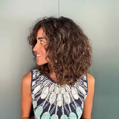Natural medium-length layered curly cut