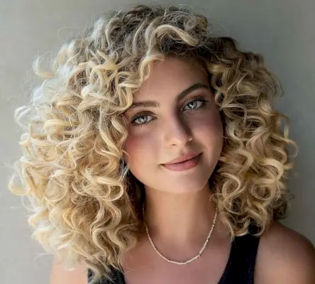 big bouncy curls on shoulder-length hair