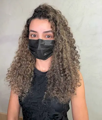 Long Natural Curls with a Deep Side Part