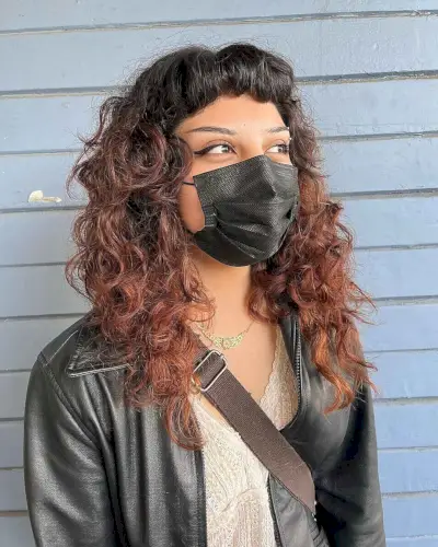 Shaggy Layers and Short Bangs for Curly Locks