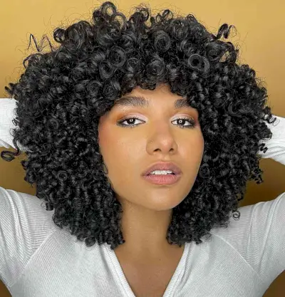 Curly Long Bob with Bangs for Thick Hair and Oval Face Shapes