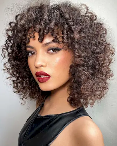 chic curly short hair with bangs