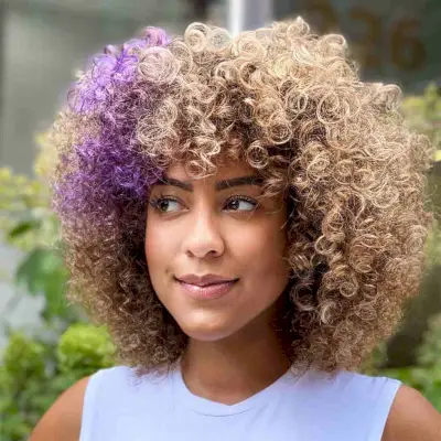Mid-Length Curly Bronde Hair with Purple Accents
