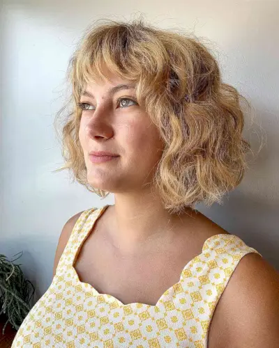 Short Chin-Length Bob with Loose Curls and Textured Bangs