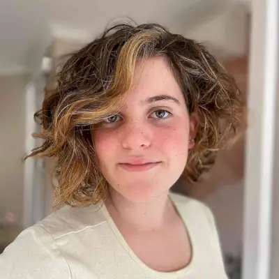 Asymmetrical Bob with Chin-Length Messy Curls for Oval Faces