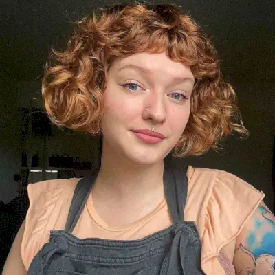 Vintage Chin-Length Curly Bob with Short Bangs