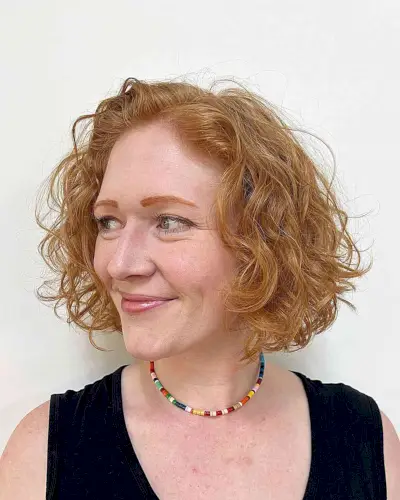 Chin-Length Copper Bob with Curls and Waves