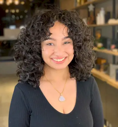 Medium-Length Curly Cut with curtain fringe