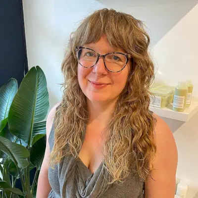 Curly Razor Cut with curtain bangs for women Over 40 with Glasses
