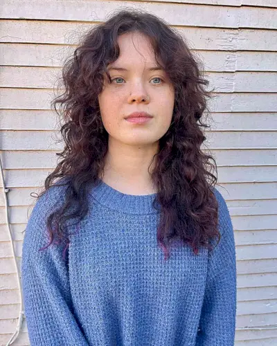 Long Tousled Curls with Curtain Middle Part Bangs