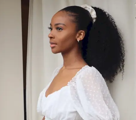 Sleek long curly ponytail style