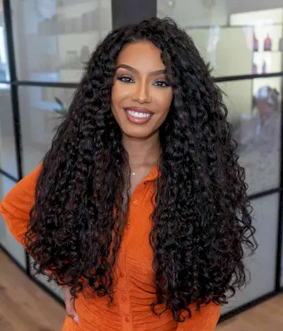layered haircut for naturally long and kinky curls