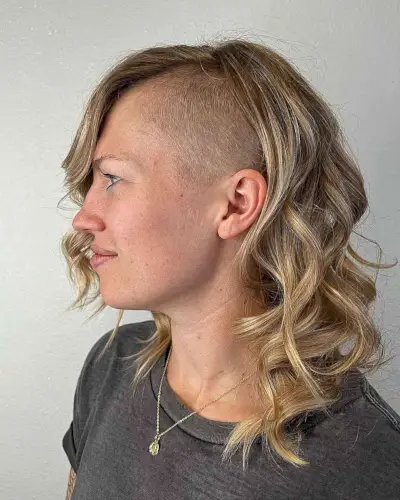 Edgy Undercut with Shaved Sides for Long Hair and women with tousled curls