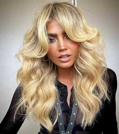 Reflective Blonde Tones with Face-Framing Layers for Long Hair with waves