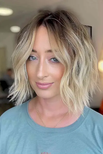 Layered bob with loose waves for oval faces