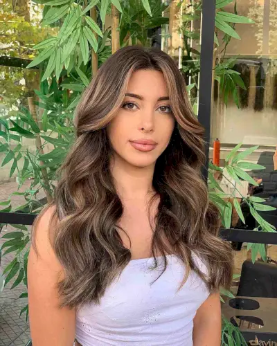 Center-Parted Long Hair with Voluminous Waves for Oval Faces