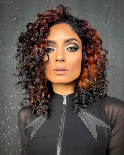 Phoenix-Inspired Mid-Length Curls for Square Faces