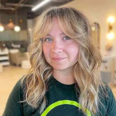 Off Center Part Layered Cut with Long Curtain Fringe for Round Faces