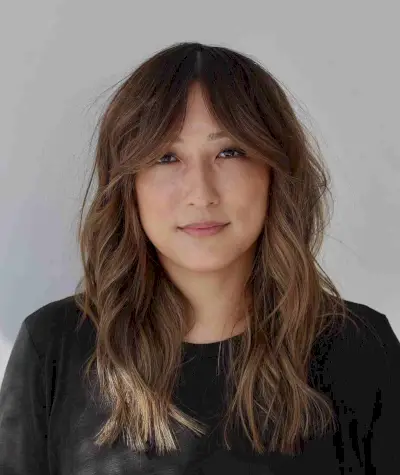 Fabulous Medium-Length Layered Waves With Curtain Bangs for Round Faces