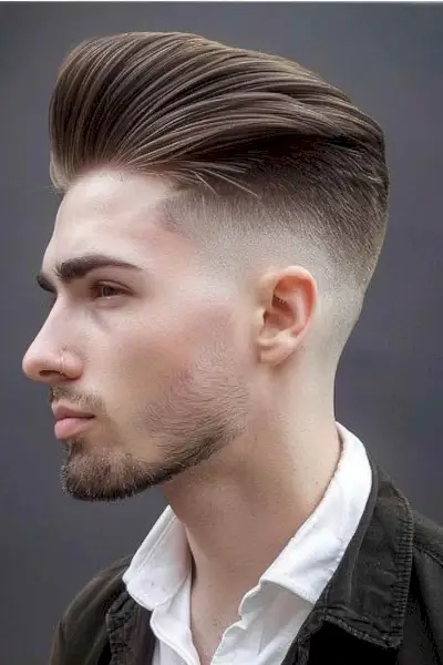Low bald fade on slick back long hair