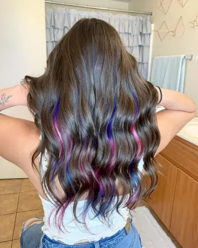 Trendy pink and blue peekaboo highlights