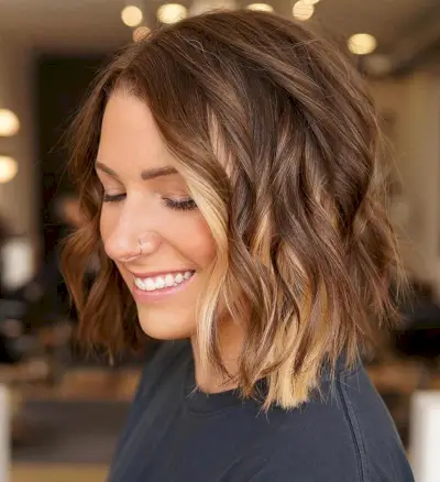 Subtle blonde peekaboo highlights on brown hair