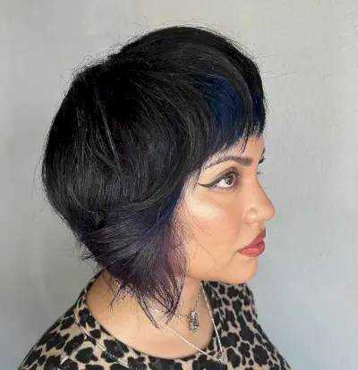 dark purple peekaboo highlights on medium brown hair