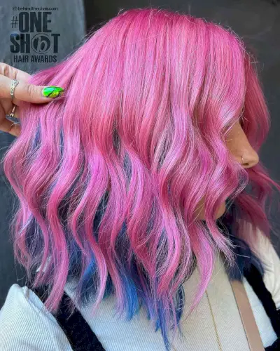 Bold Pink Hair with Blue Peekaboo Highlights Underneath