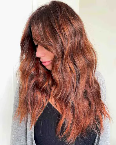 Touchable copper highlights on brown hair