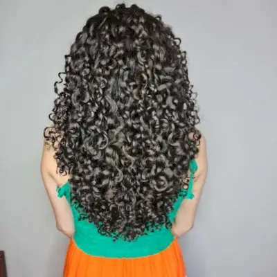 V-shape feathered haircut for curly hair