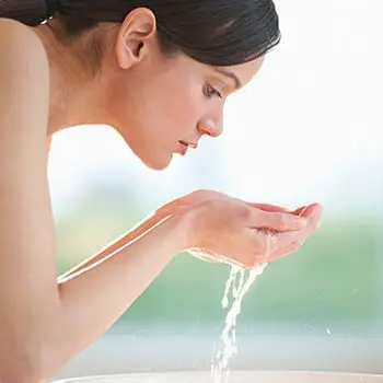 woman washing face