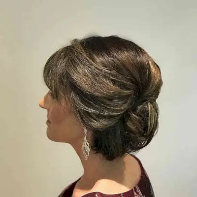 Pinned Updo with Eye-Grazing Fringe