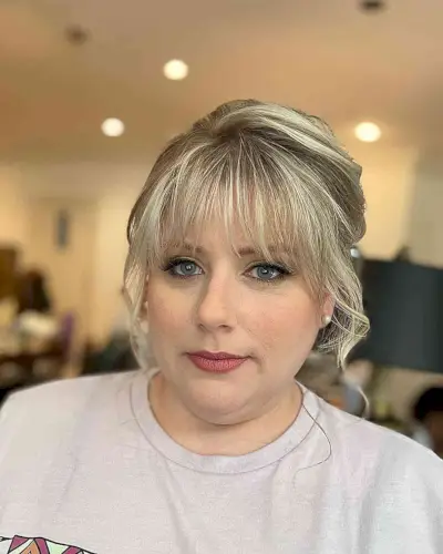 Loose Updo with Wispy Bangs for Round Faces
