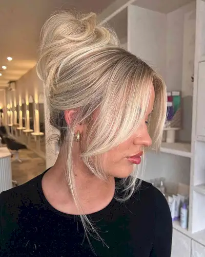 Soft Updo with Face-Framing Layers and Bangs