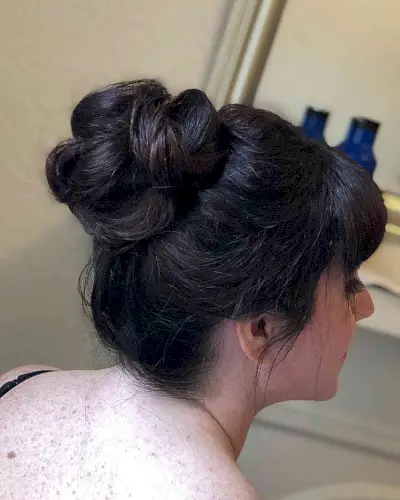 Loose Updo with Bangs on Dark Hair