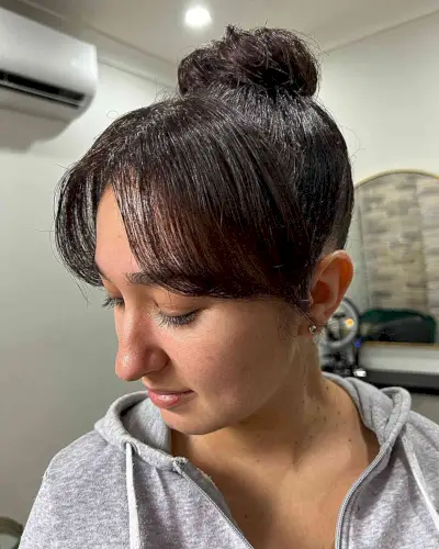 Top Knot Bun Updo with Middle Part Bangs
